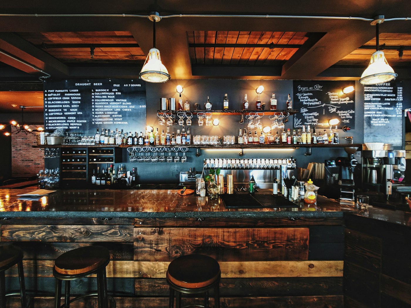 Long bar with draft taps and chalkboard menu